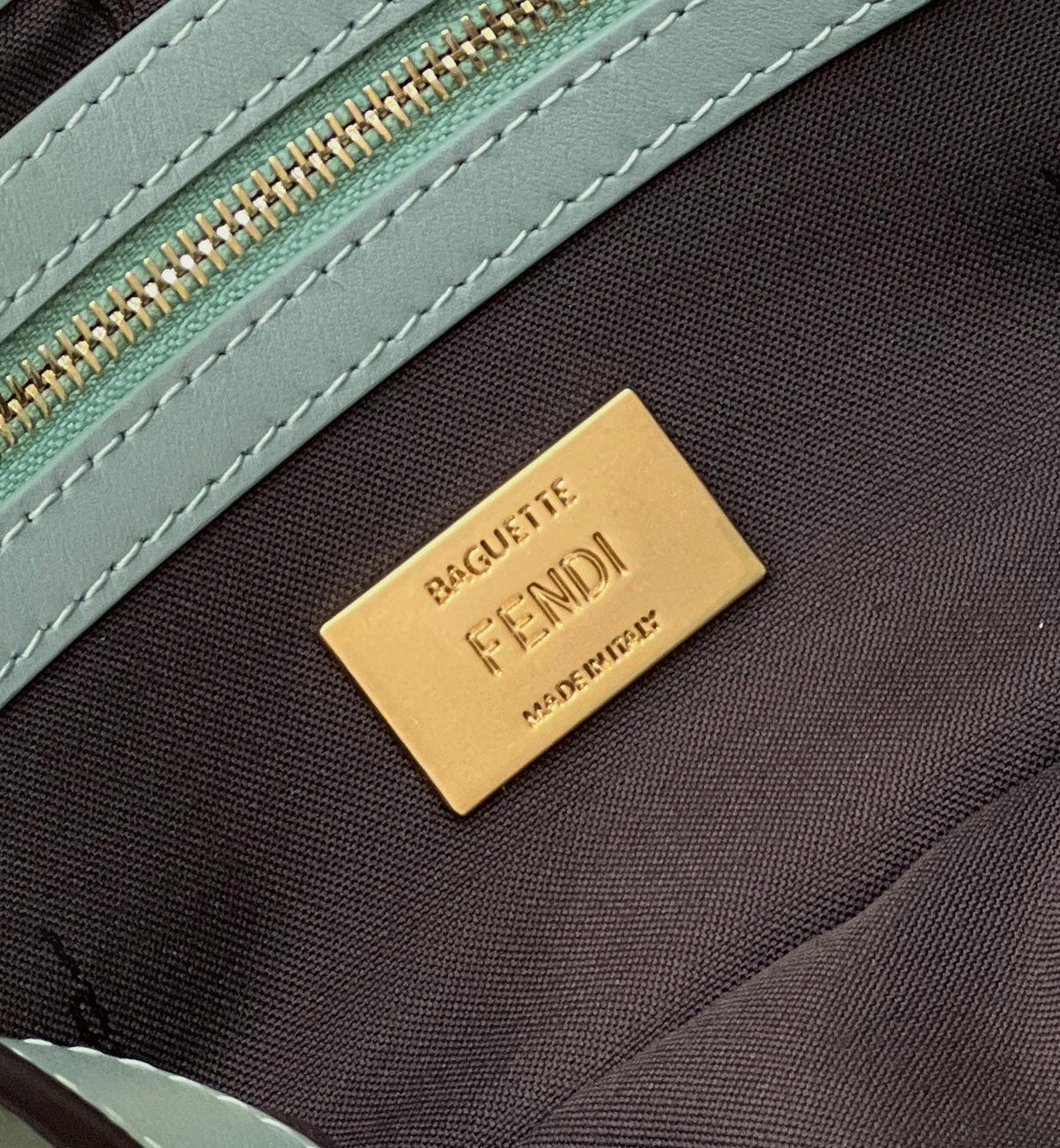 FENDI BAGUETTE WITH FF MOTIF 27 IN VIRIDIAN GREEN SOFT LAMBSKIN GOLD HARDWARE