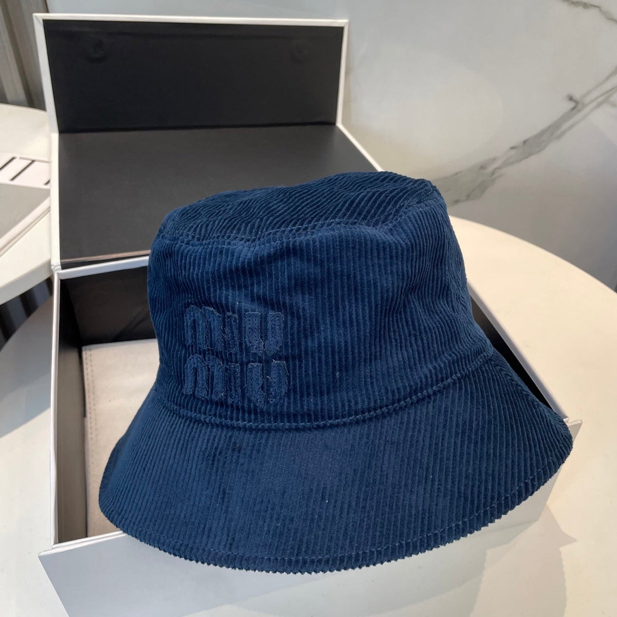 MIU MIU MM BUCKET IN NAVY BLUE VELVET WITH LOGO