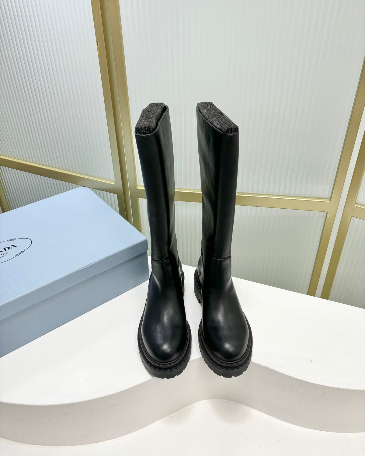 PRADA KNEE BOOTS WITH TRIANGLE LOGO IN BLACK CALFSKIN