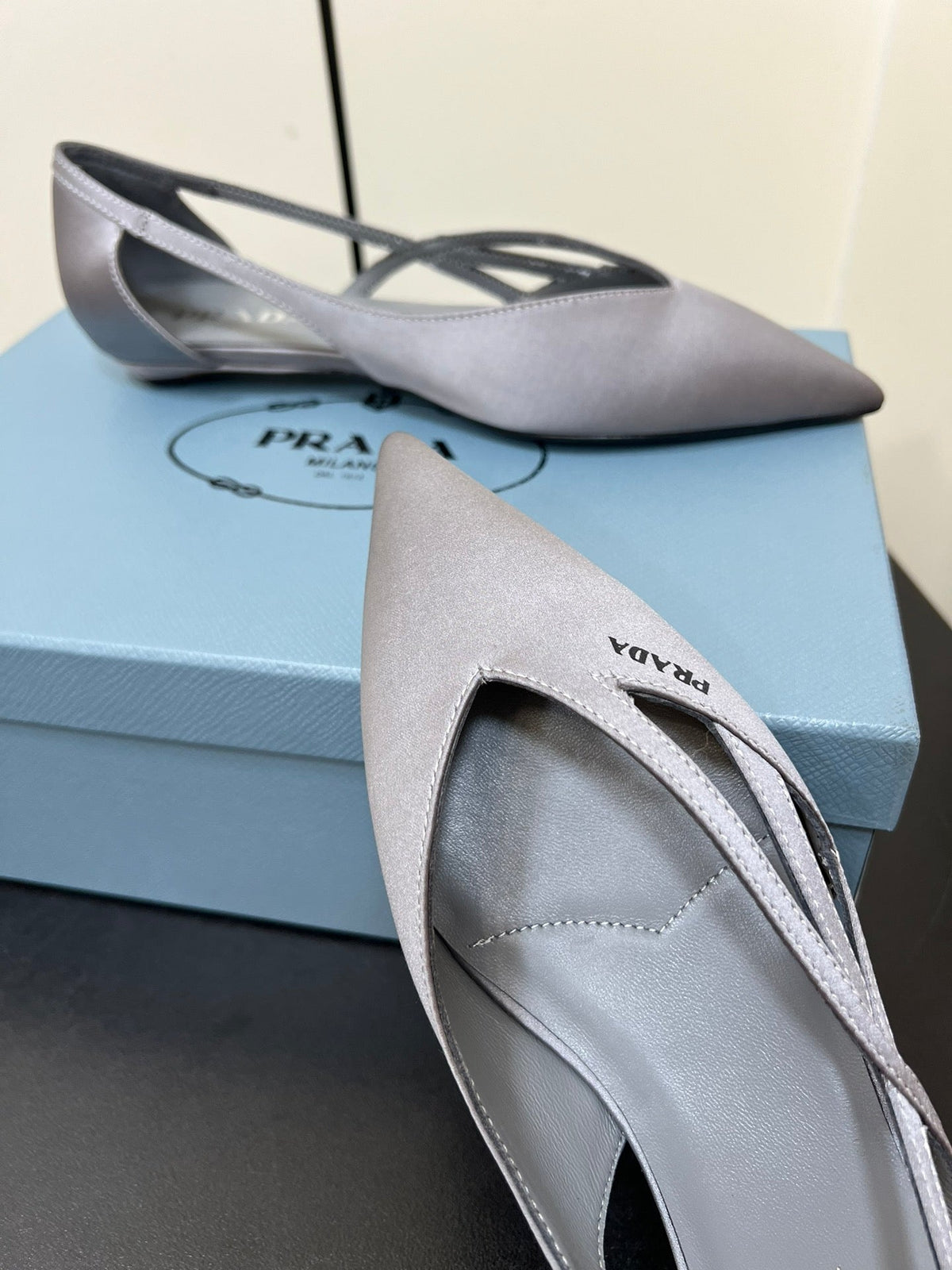 PRADA CUT-OUT BALLERINAS IN WARM GRAY SATIN