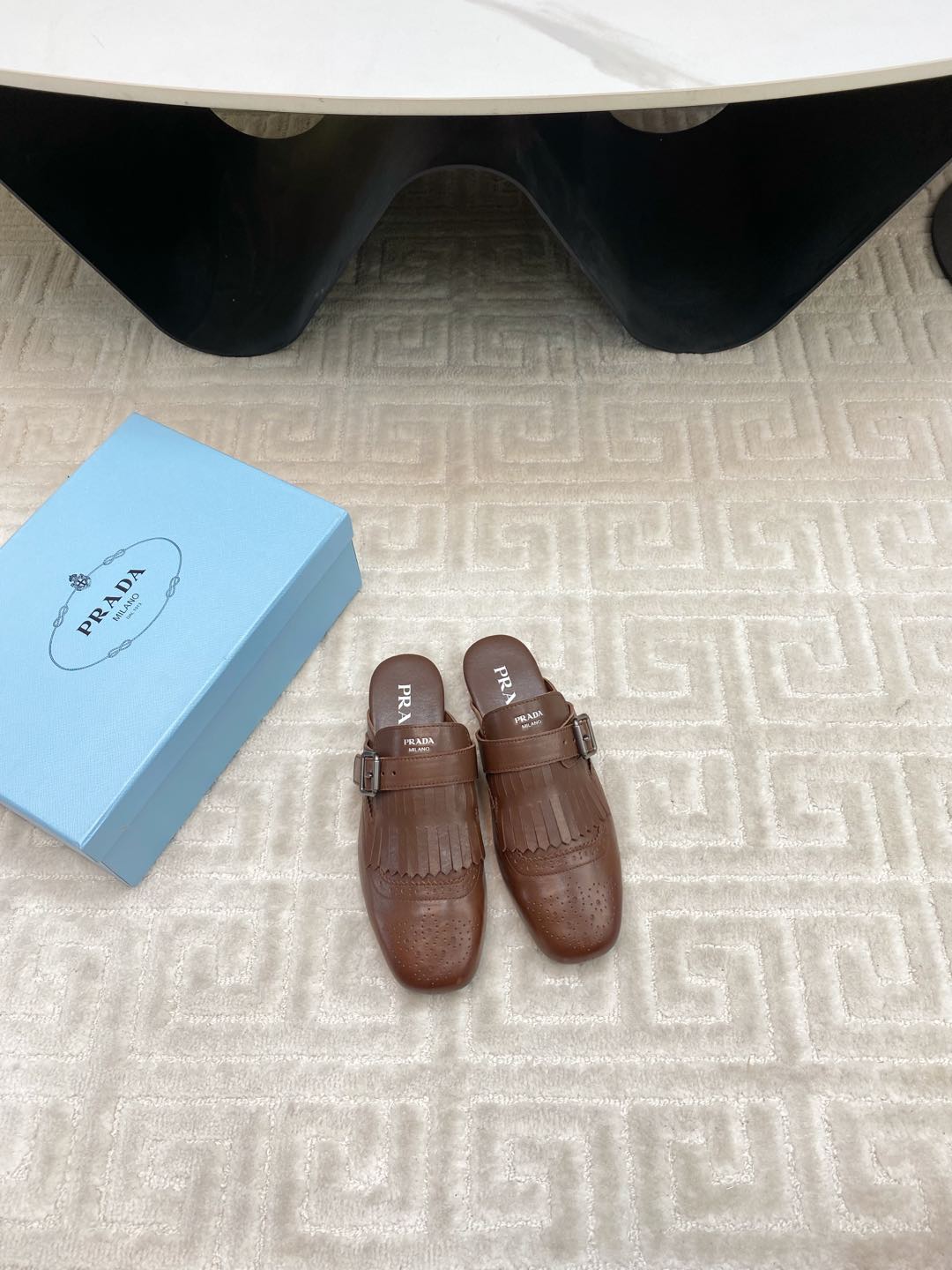 PRADA TASSEL MULES IN RUSSET BROWN LAMBSKIN