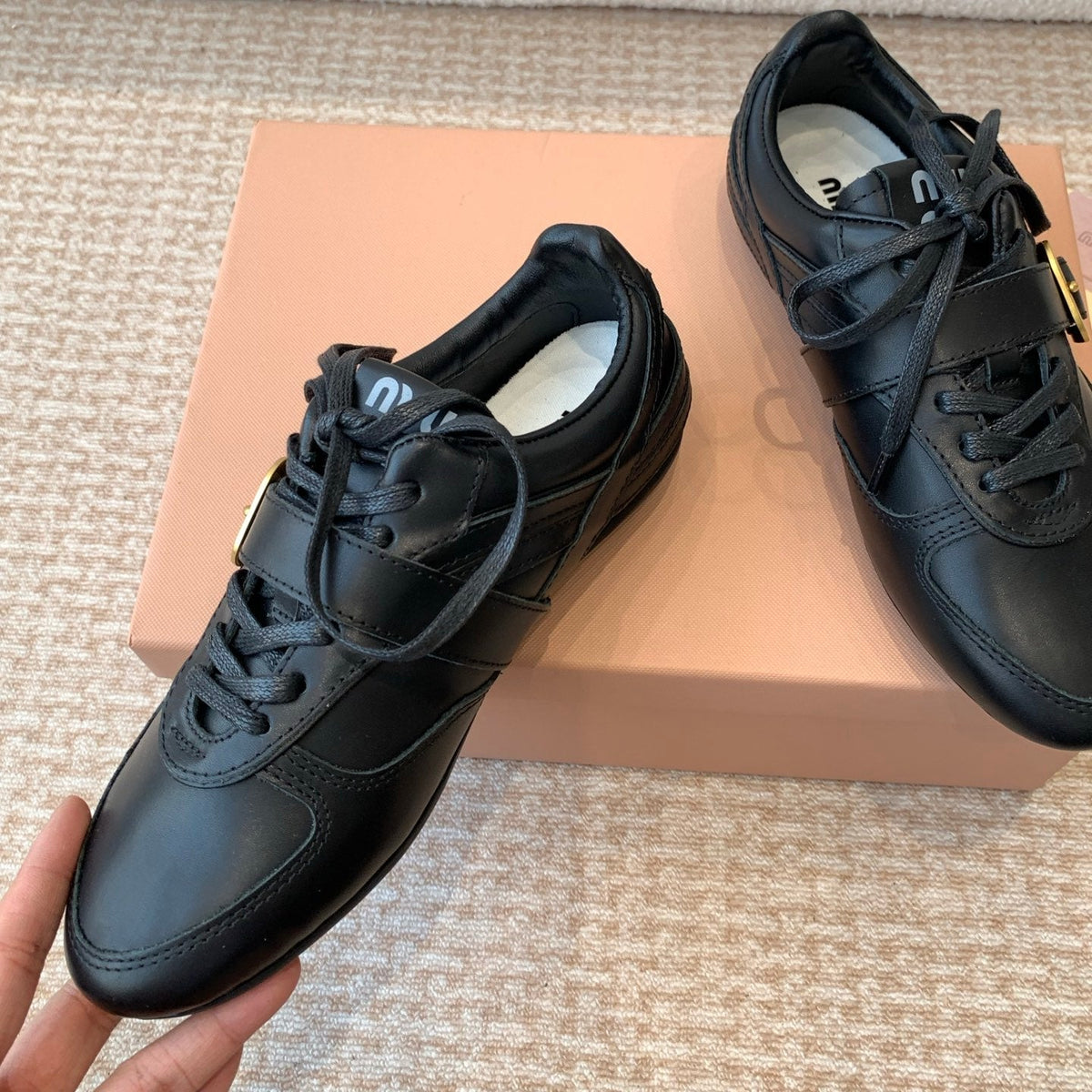 GYMNASIUM SNEAKER IN BLACK CALFSKIN WITH GOLD BUCKLED STRAP