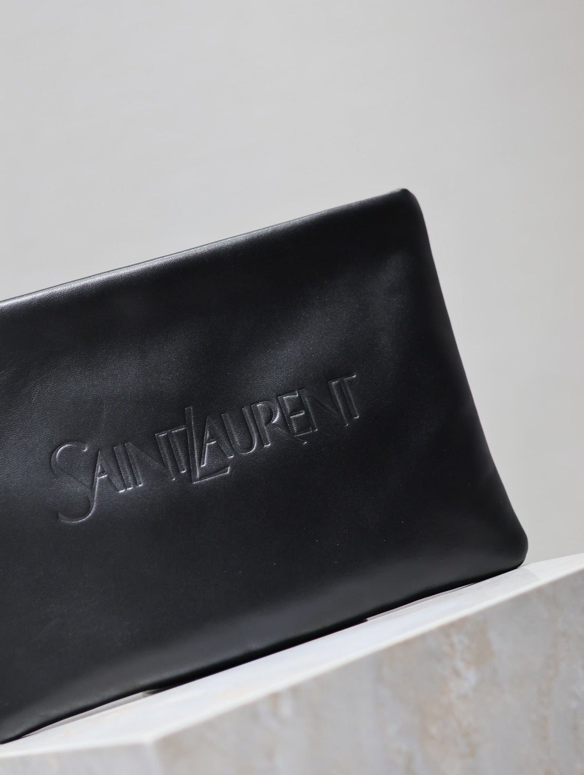 SAINT LAURENT POUCH 30 IN BLACK CALFSKIN WITH EMBOSSED LOGO