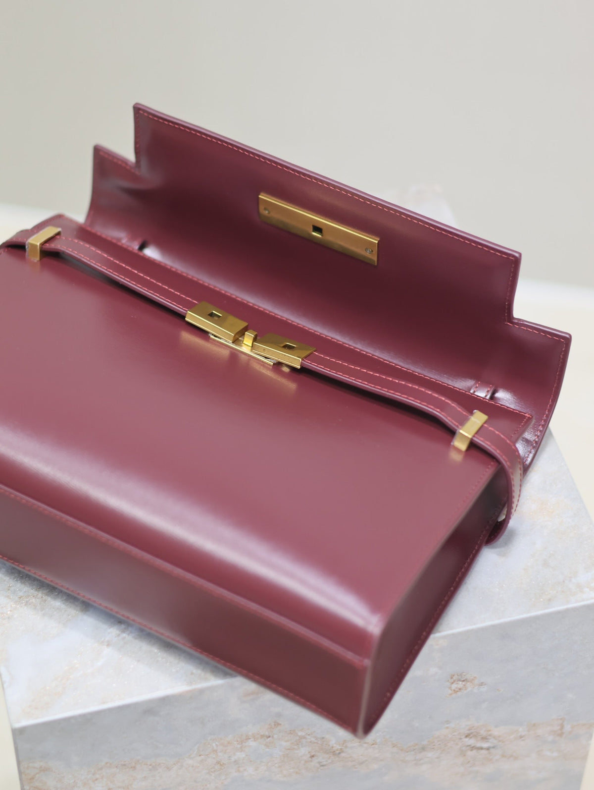 SAINT LAURENT MANHATTAN MEDIUM 29 IN WINE RED SMOOTH CALFSKIN GOLD BUCKLE