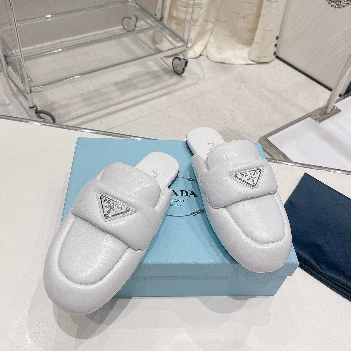 PRADA SOFT PADDED NAPPA SHEARLING MULES WHITE LAMBSKIN