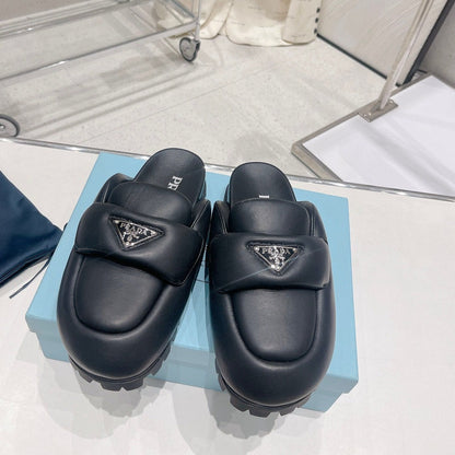PRADA SOFT PADDED NAPPA SHEARLING MULES BLACK LAMBSKIN