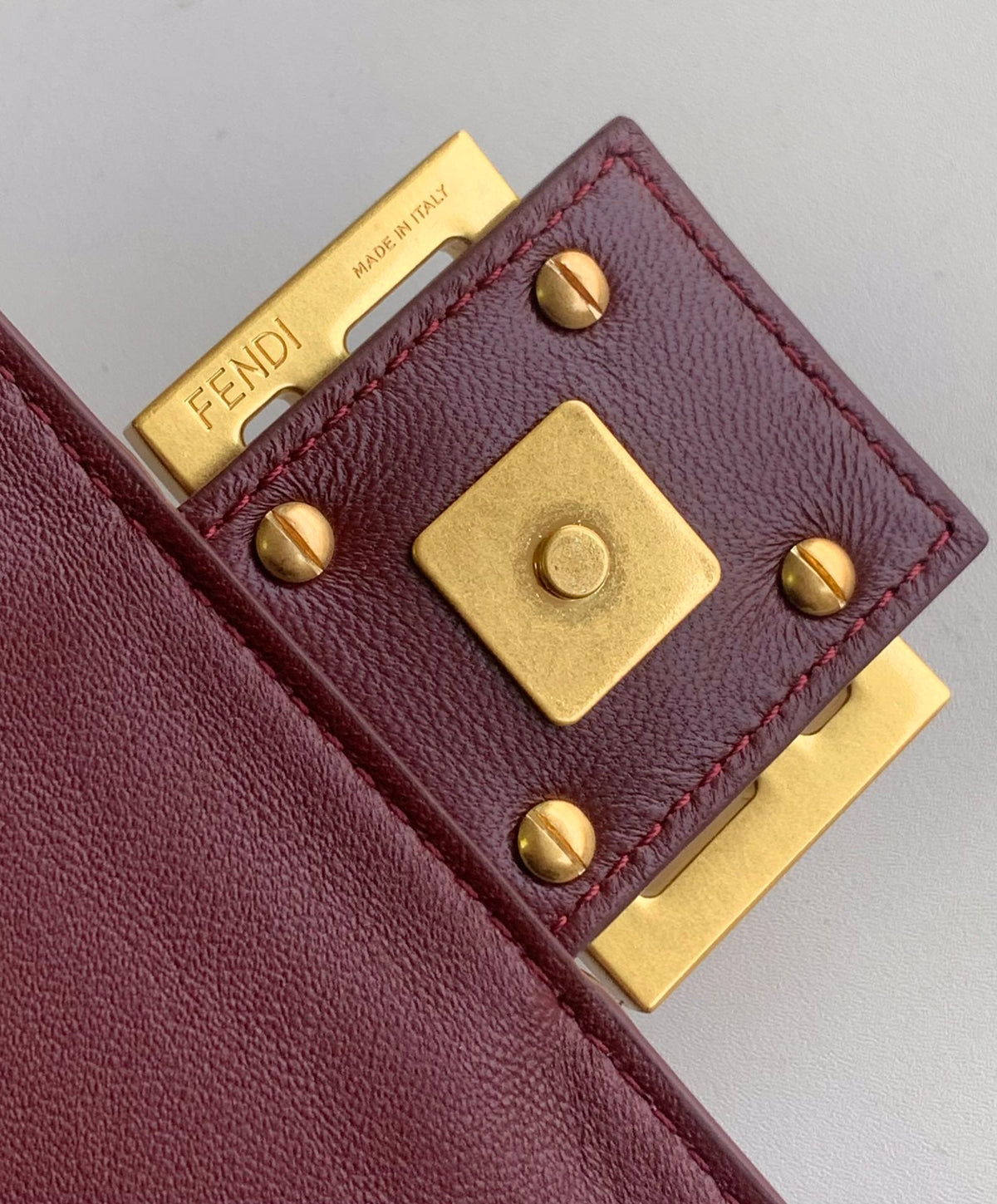 FENDI Fend Baguette 27 Bag With FF Motif Burgundy Leather Ghw