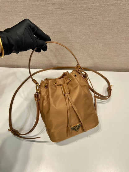 PRADA BUCKET BAG 19 IN RUSSET BROWN RE-NYLON AND CALFSKIN HANDLE