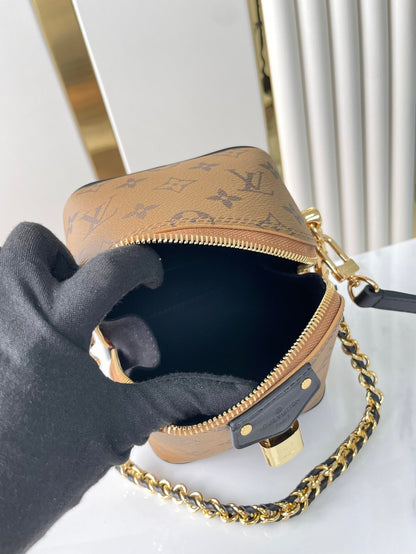 LOUIS VUITTON JUST IN CASE 14 IN BROWN MONOGRAM REVERSE CANVAS GOLD HARDWARE