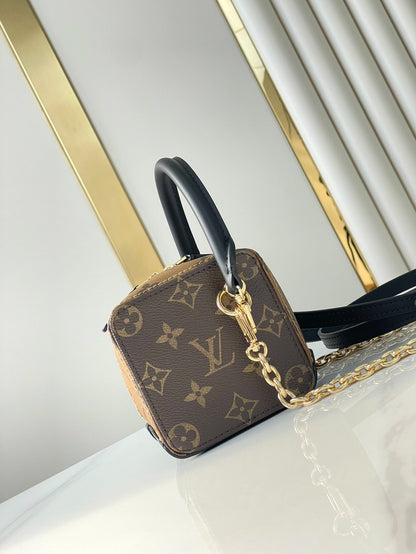 LOUIS VUITTON DICE 9 IN BROWN MONOGRAM AND MONOGRAM REVERSE CANVAS GOLD HARDWARE