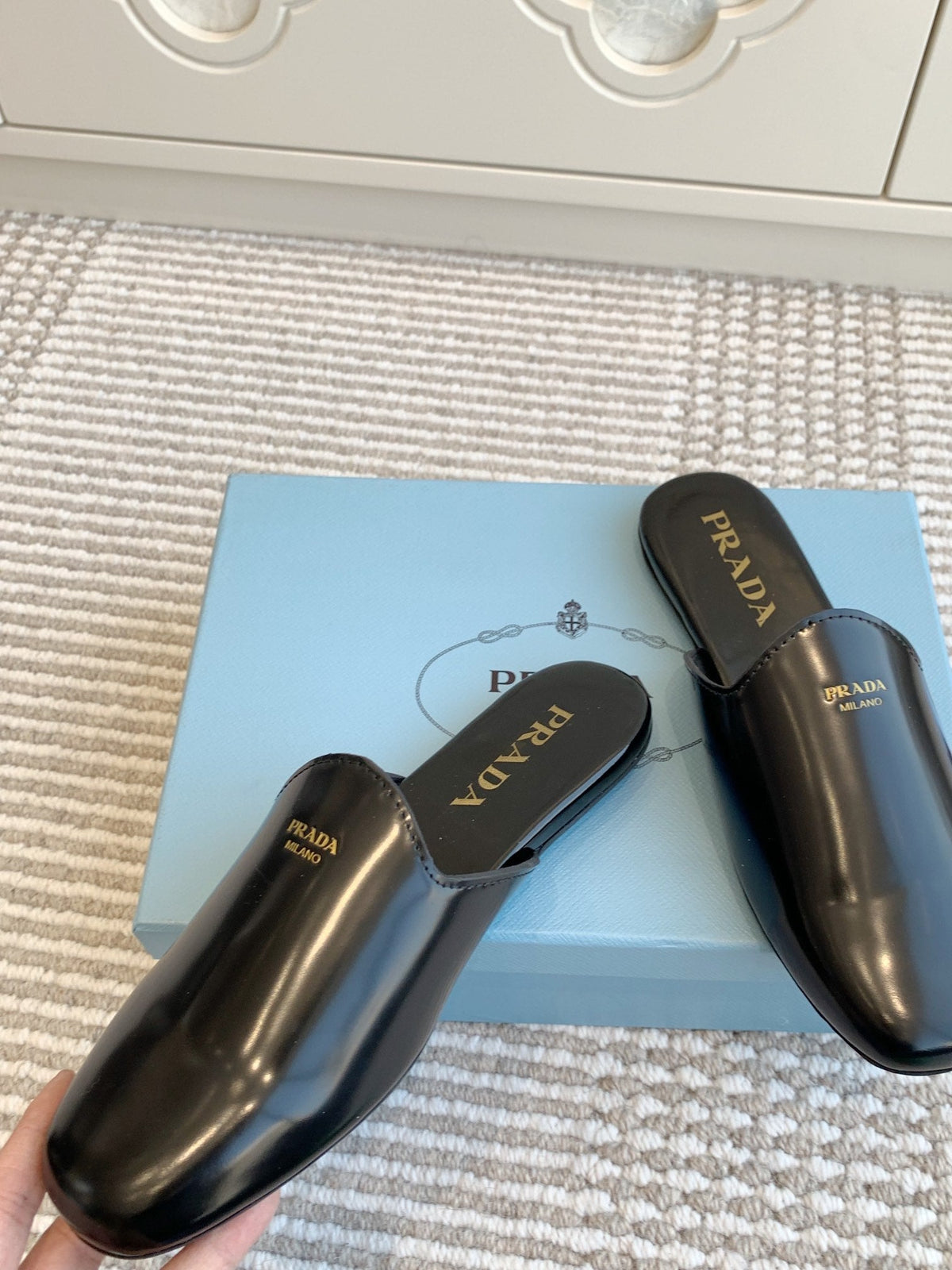 PRADA MULES IN BLACK GLOSSY SHEEPSKIN GOLD LETTERING LOGO