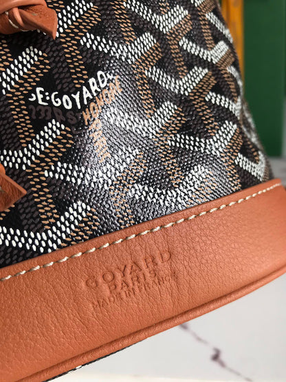GOYARD PETIT FLOT BUCKET BAG 22 IN BLACK GOYARDINE CANVAS AND TAN LAMBSKIN TRIM