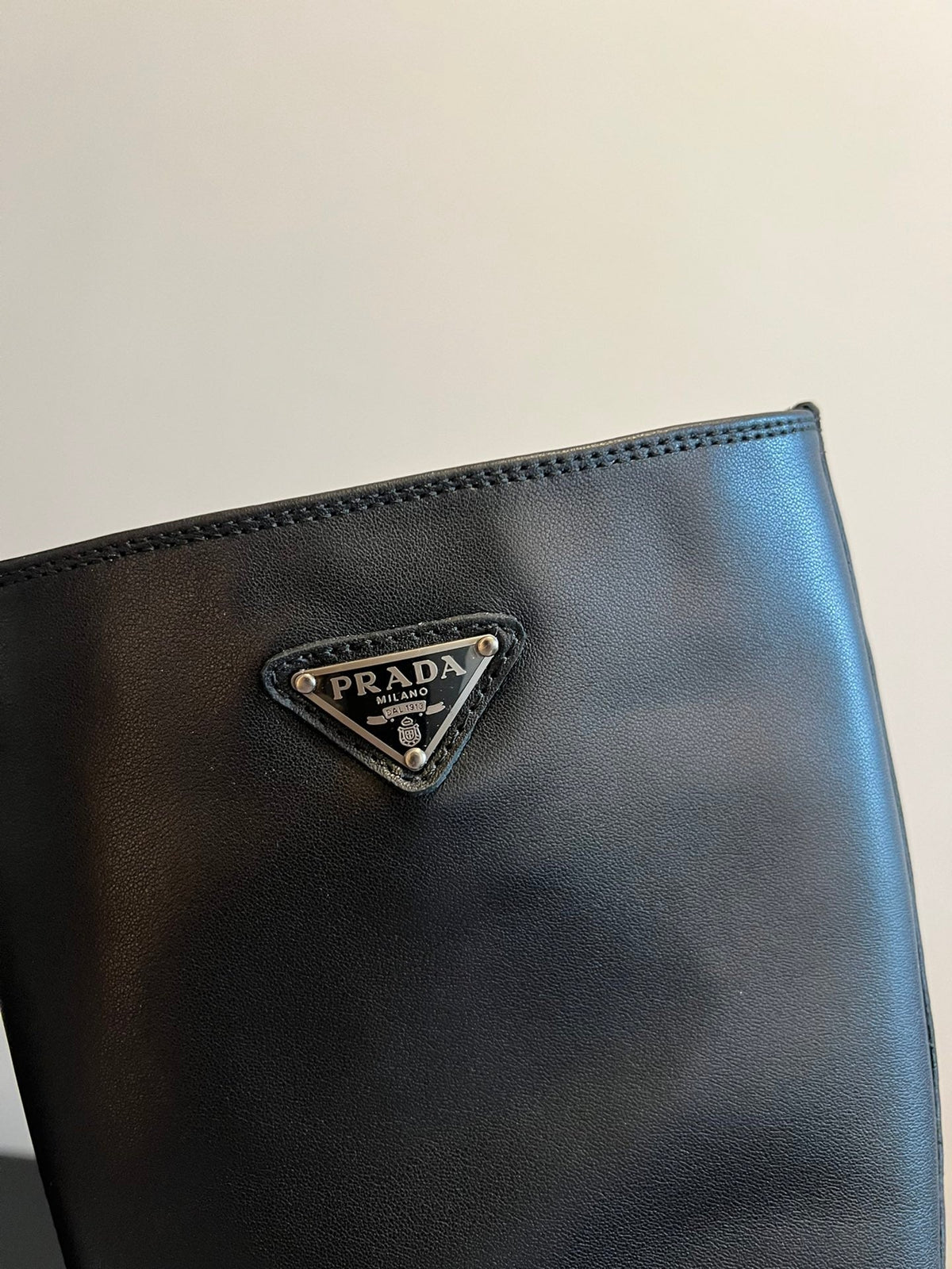 PRADA 25S HIGH-CUT PLATFORM BOOTS IN BLACK CALFSKIN WITH SILVER HARDWARE