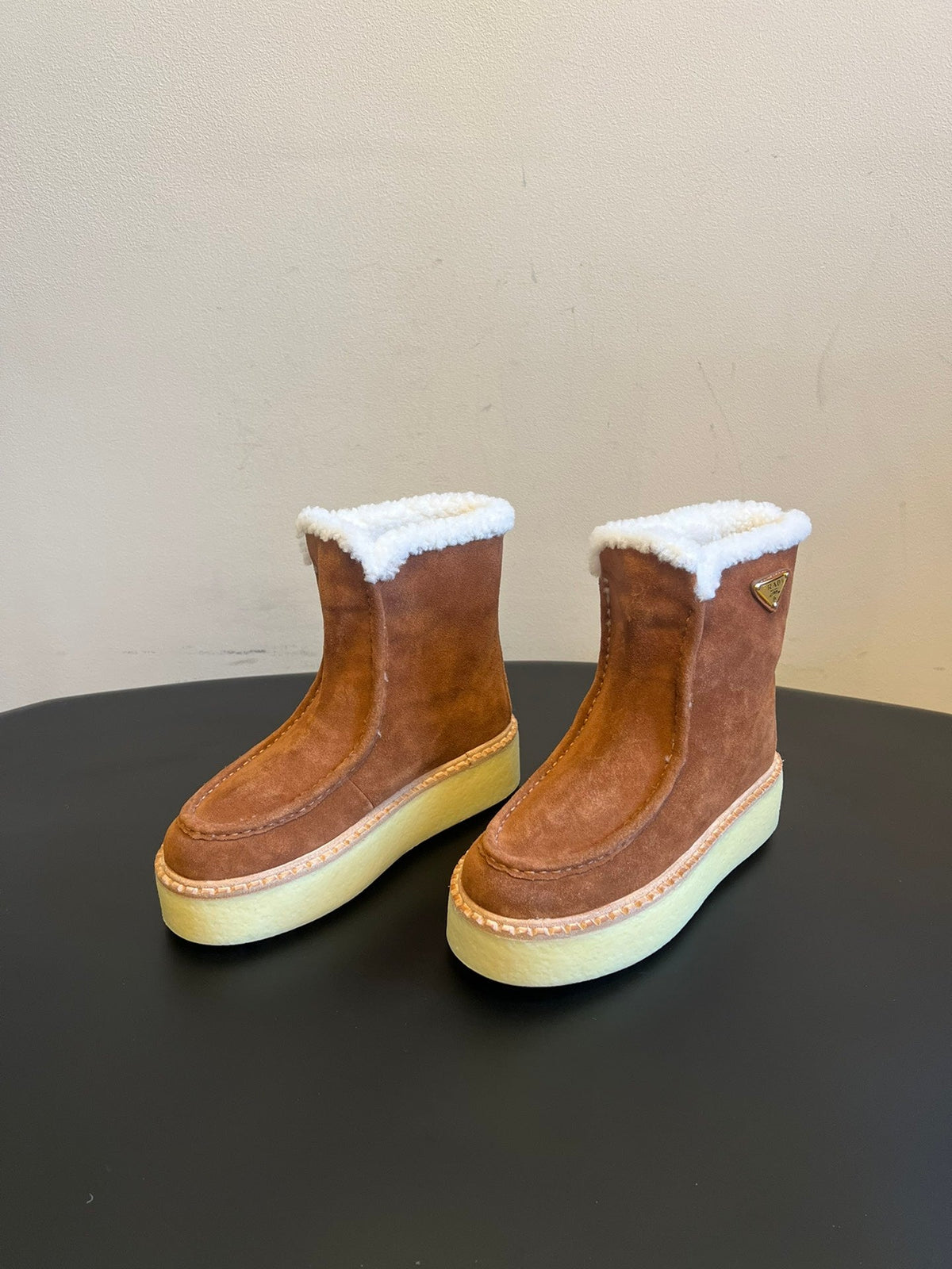 PRADA 25S PLATFORM ANKLE BOOTS 40 MM IN BROWN SUEDE SHEARLING-LINED