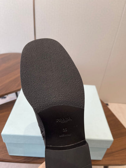 PRADA 25S COWBOY BOOTS IN RK BLACK-BROWN CALFSKIN