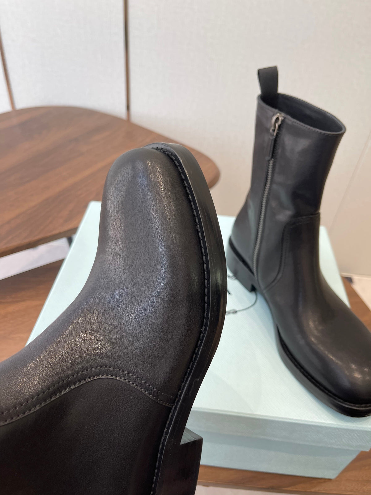 PRADA 25S COWBOY BOOTS IN RK BLACK-BROWN CALFSKIN