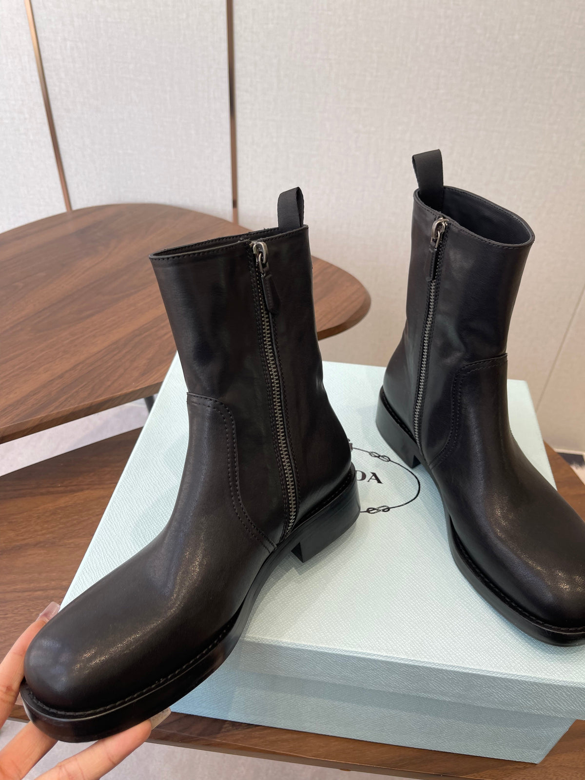 PRADA 25S COWBOY BOOTS IN RK BLACK-BROWN CALFSKIN
