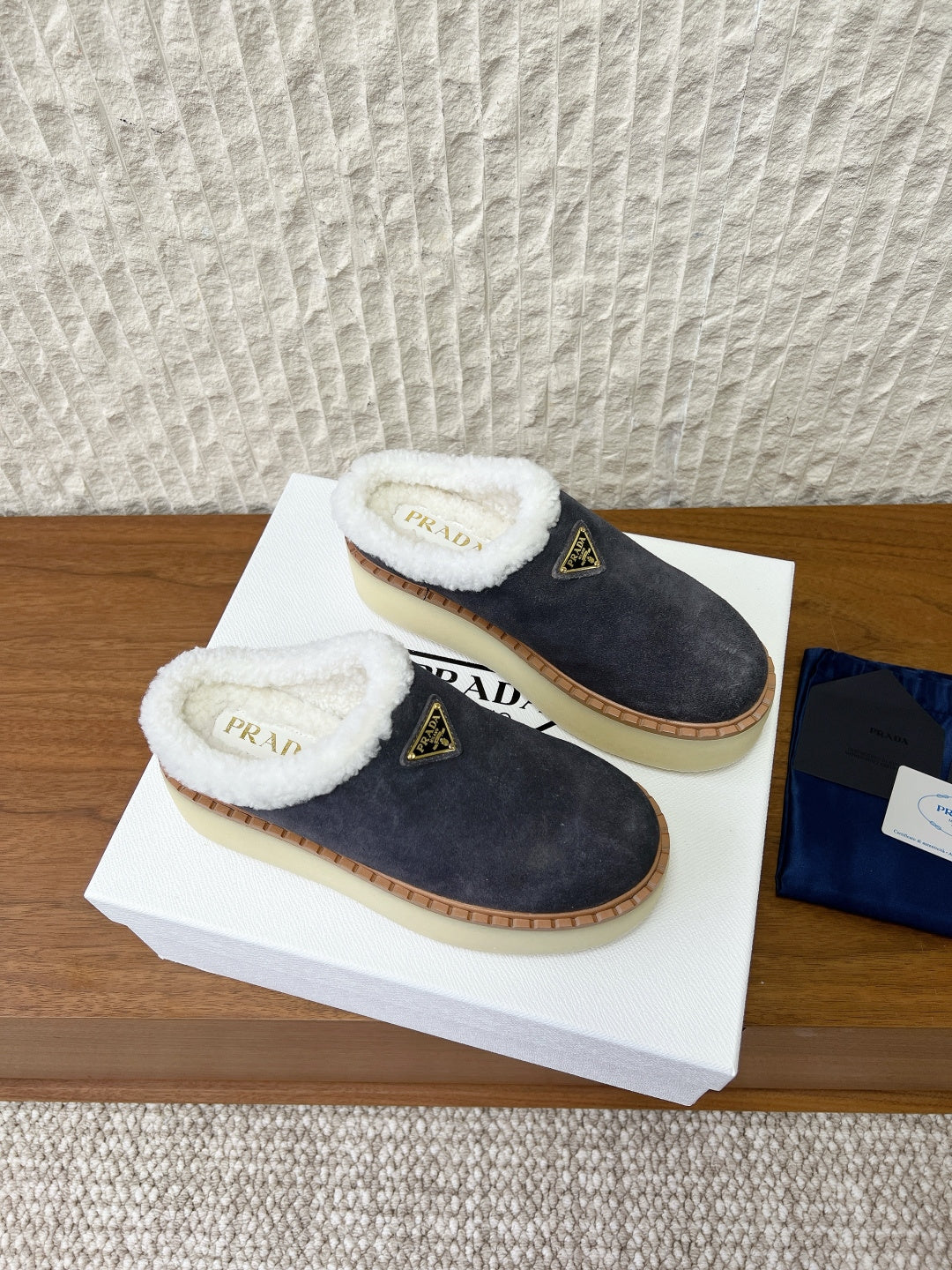PRADA 25S PLATFORM FUR-LINED MULES IN RK GREY SUEDE