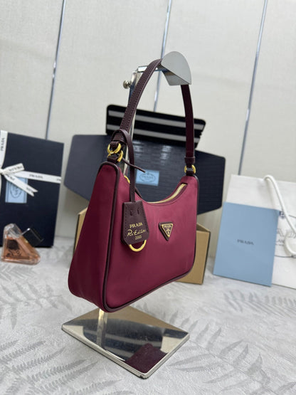 PRADA 25S RE-EDITION 2005 MINI BAG 22 IN BURGUNDY RE-NYLON AND SAFFIANO