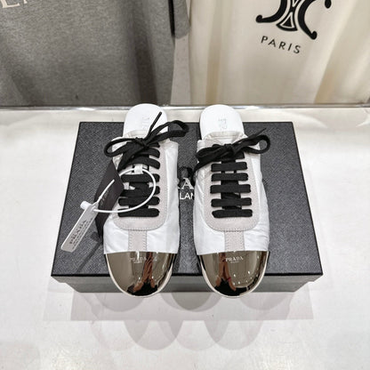PRADA 25S MULES IN WHITE WITH METAL TOECAP