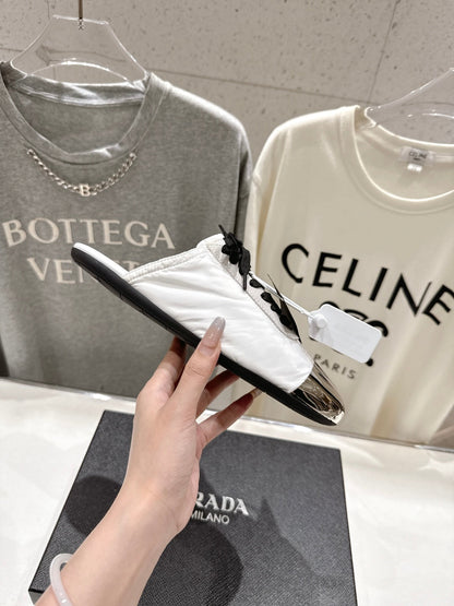 PRADA 25S MULES IN WHITE WITH METAL TOECAP