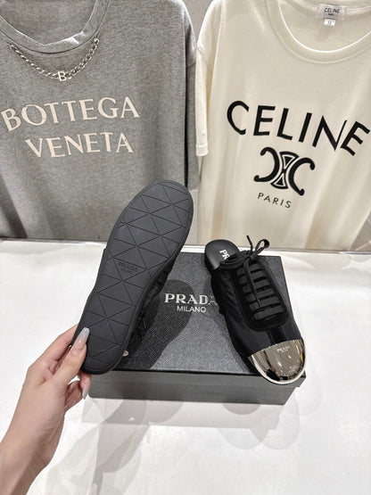 PRADA 25S MULES IN BLACK WITH METAL TOECAP