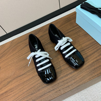 PRADA LACE-UP HIGH SHOES IN BLACK SILK MIX GLOSSY CALFSKIN