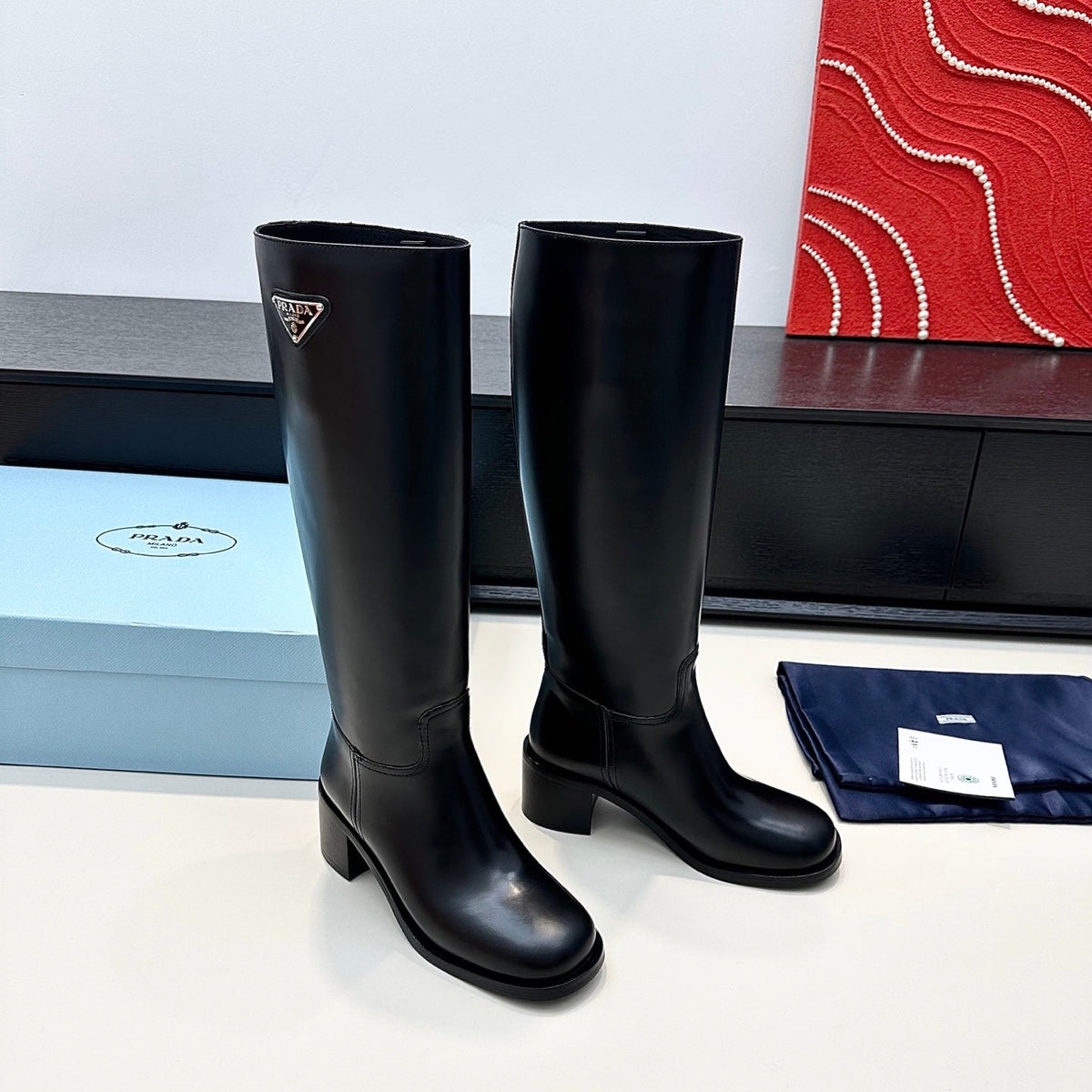 PRADA 25S HIGH-CUT BOOTS 55 MM IN BLACK CALFSKIN