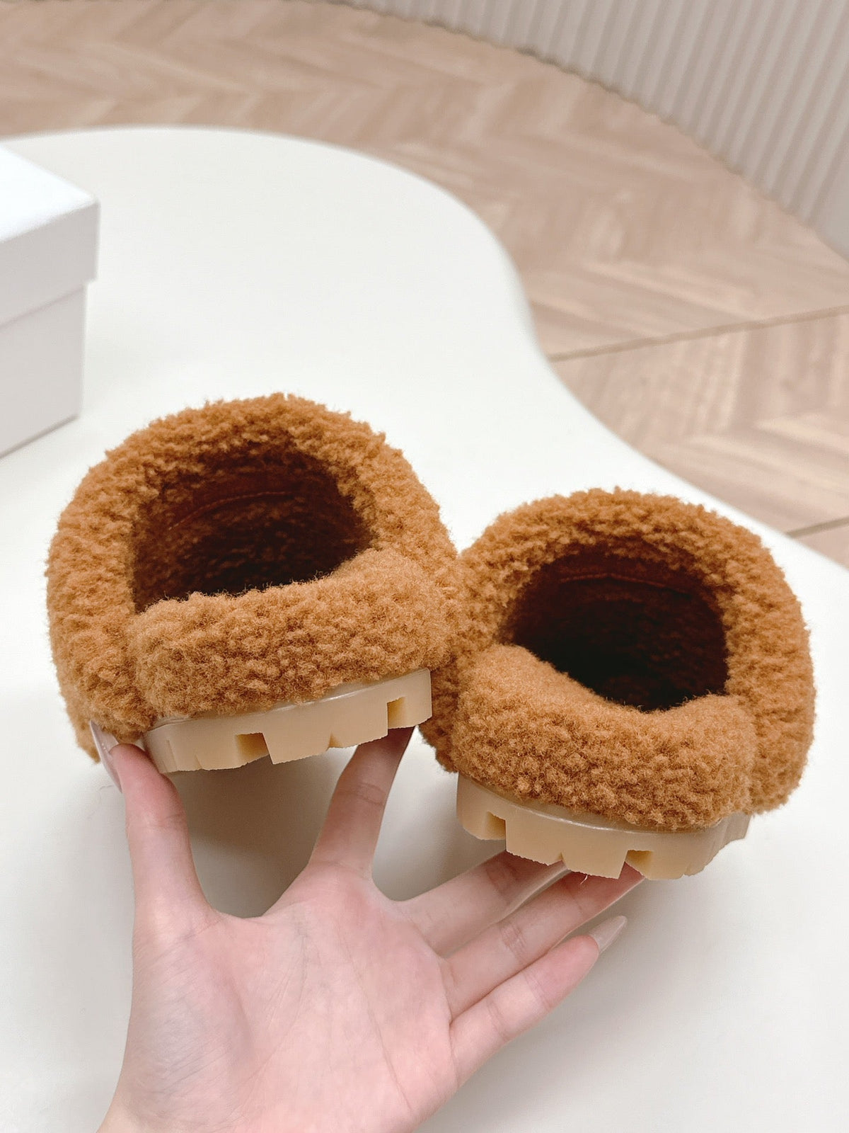 PRADA MULES ATTACHED TRIANGLE LOGO IN BRONZE BROWN SHEARLING