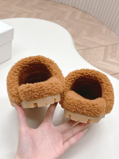 PRADA MULES ATTACHED TRIANGLE LOGO IN BRONZE BROWN SHEARLING