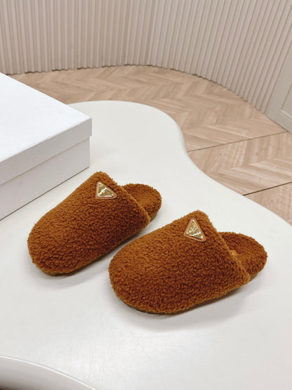 PRADA MULES ATTACHED TRIANGLE LOGO IN BRONZE BROWN SHEARLING