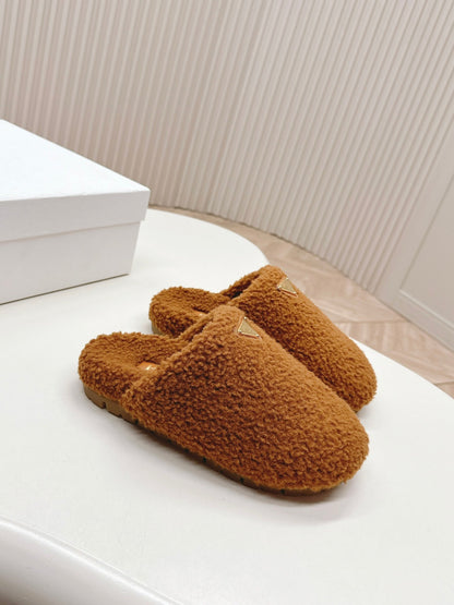 PRADA MULES ATTACHED TRIANGLE LOGO IN BRONZE BROWN SHEARLING