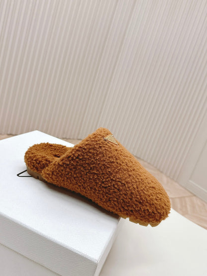 PRADA MULES ATTACHED TRIANGLE LOGO IN BRONZE BROWN SHEARLING