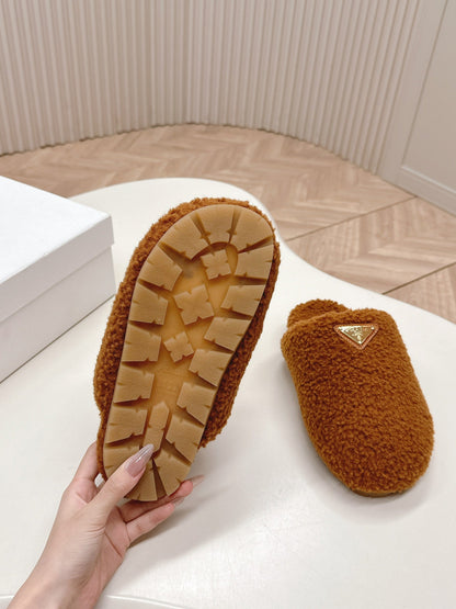 PRADA MULES ATTACHED TRIANGLE LOGO IN BRONZE BROWN SHEARLING