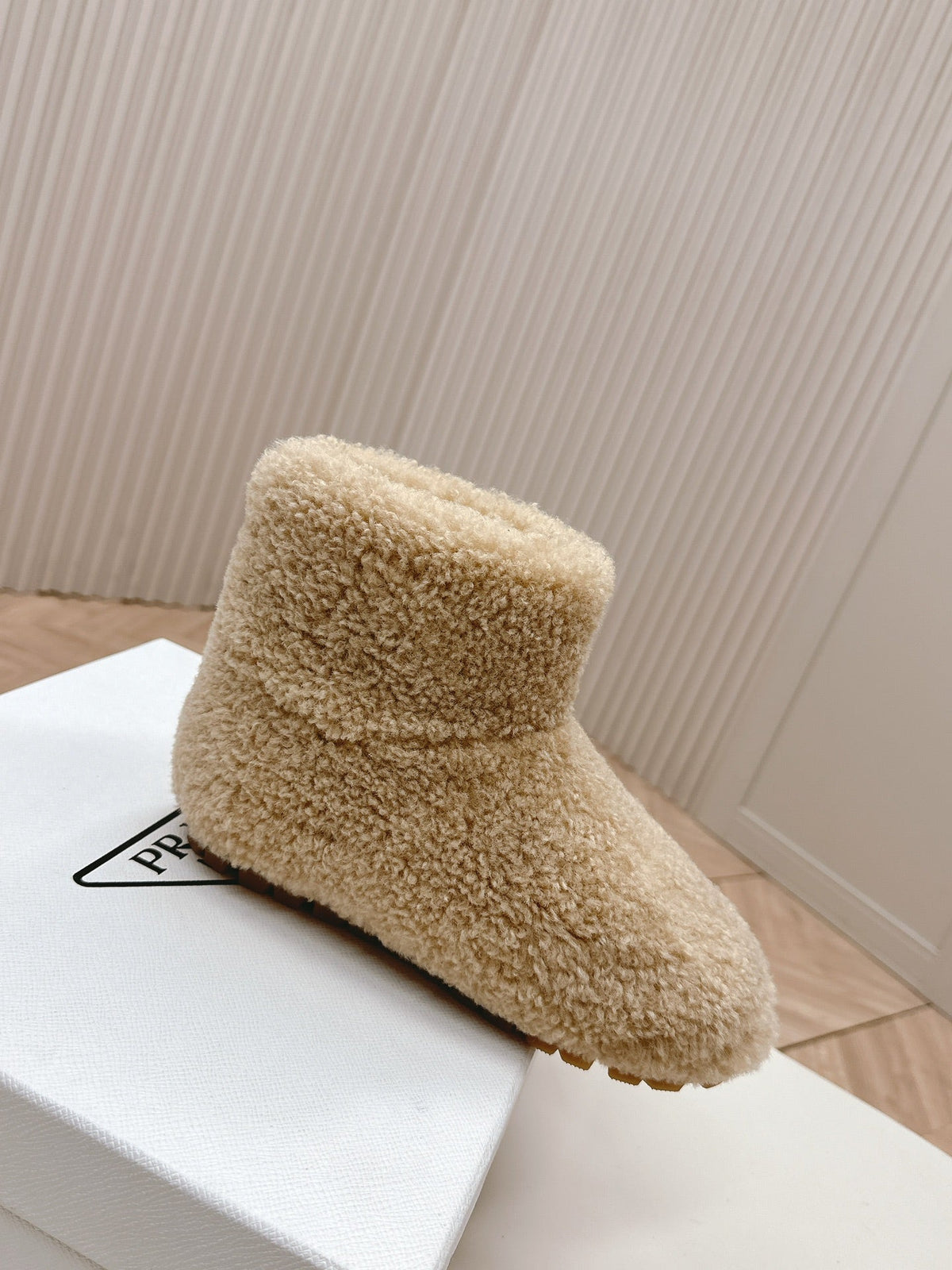PRADA SNOW ANKLE BOOTS IN BEIGE SHEARLING