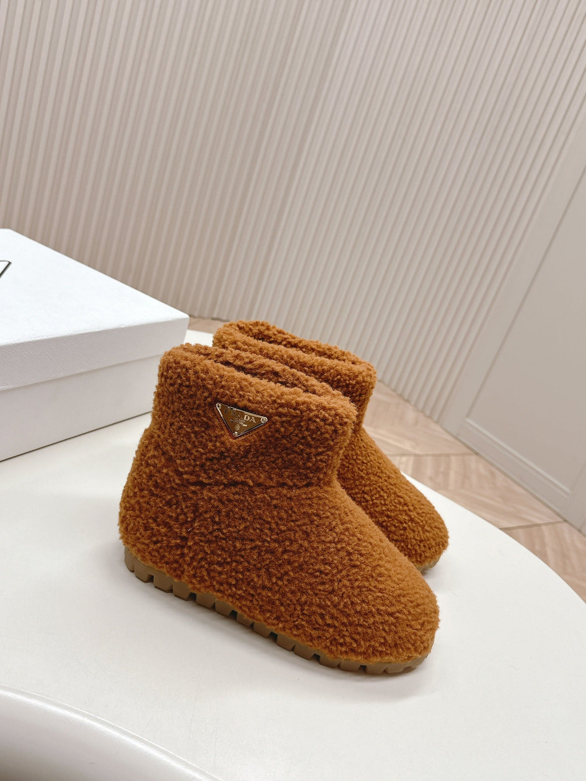PRADA SNOW ANKLE BOOTS IN BRONZE BROWN SHEARLING