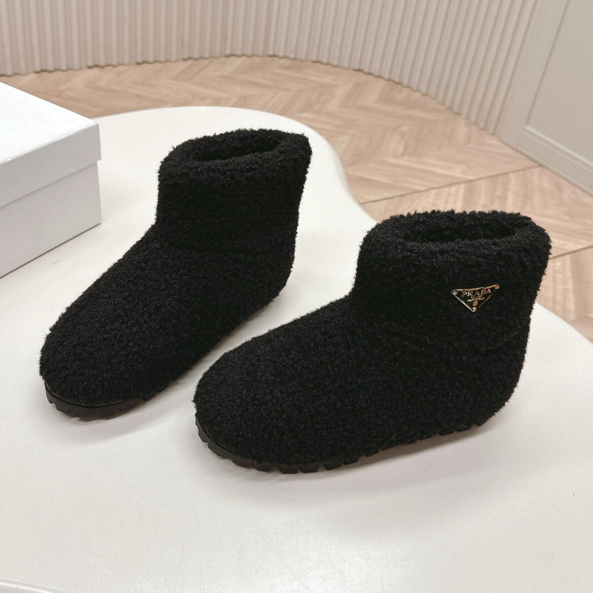 PRADA SNOW ANKLE BOOTS IN BLACK SHEARLING