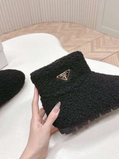 PRADA SNOW ANKLE BOOTS IN BLACK SHEARLING