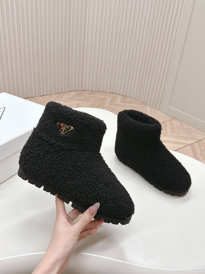 PRADA SNOW ANKLE BOOTS IN BLACK SHEARLING