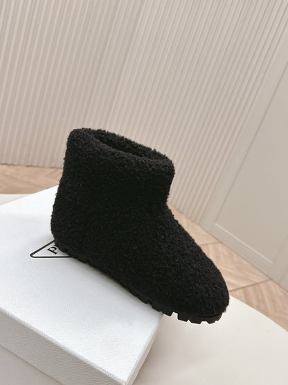 PRADA SNOW ANKLE BOOTS IN BLACK SHEARLING