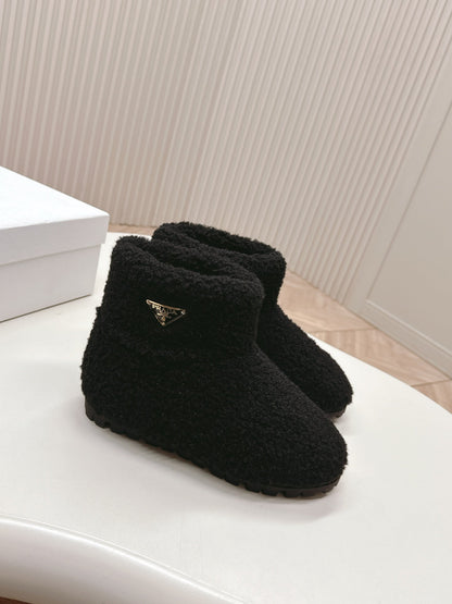 PRADA SNOW ANKLE BOOTS IN BLACK SHEARLING