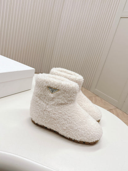 PRADA SNOW ANKLE BOOTS IN WHITE SHEARLING