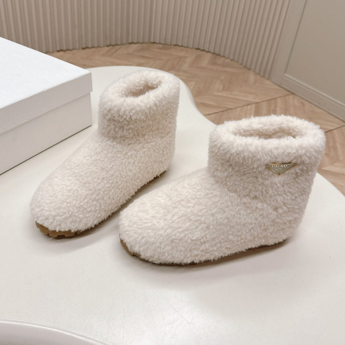 PRADA SNOW ANKLE BOOTS IN WHITE SHEARLING