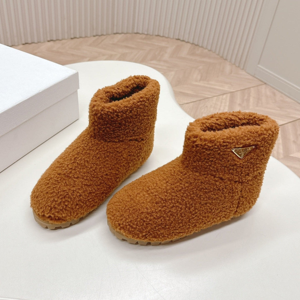 PRADA SNOW ANKLE BOOTS IN BRONZE BROWN SHEARLING
