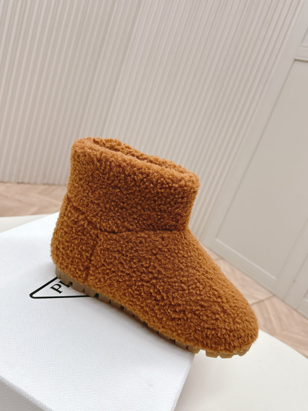 PRADA SNOW ANKLE BOOTS IN BRONZE BROWN SHEARLING