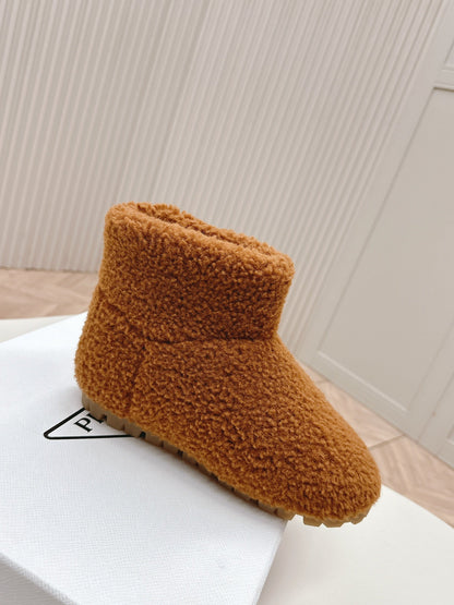 PRADA SNOW ANKLE BOOTS IN BRONZE BROWN SHEARLING