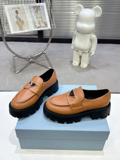 PRADA 25S THICK-SOLE LOAFERS 60 MM IN COGNAC BROWN CALFSKIN