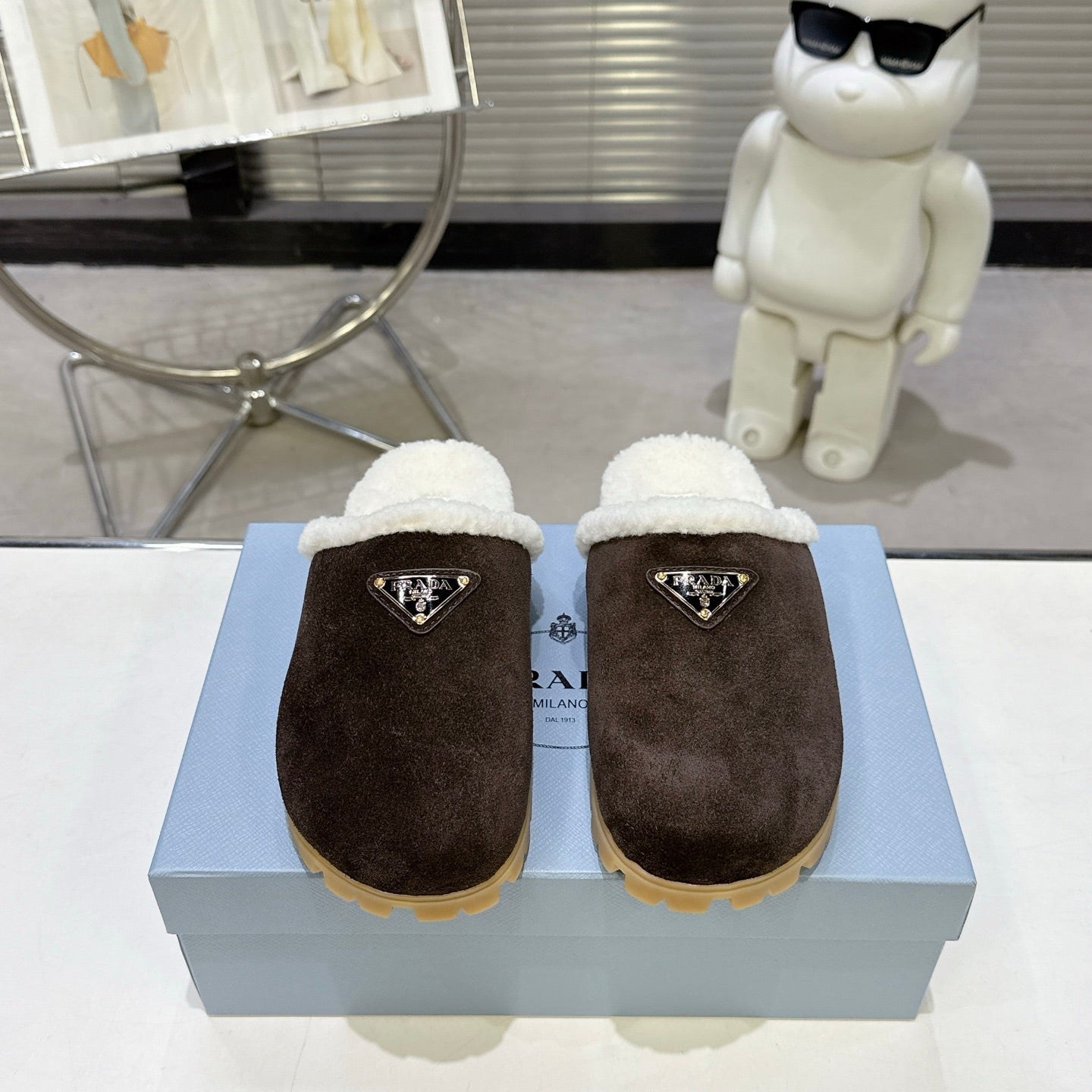 PRADA 25S FUR-LINED MULES IN RK BROWN SUEDE