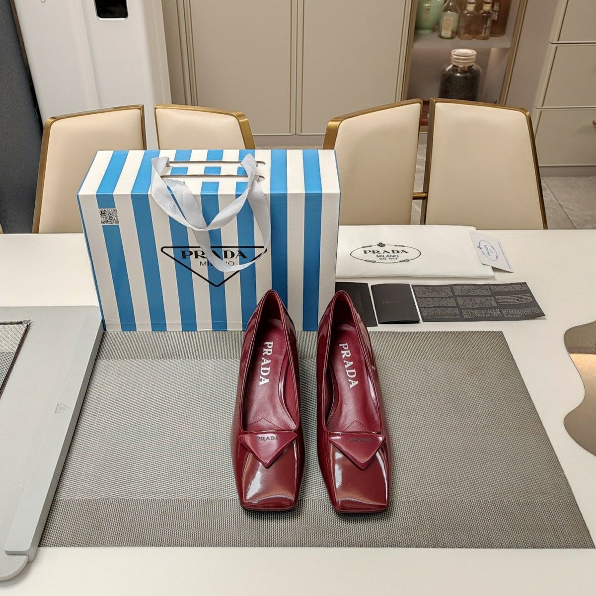 PRADA TRIANGLE LOGO PUMPS IN CURRANT RED GLOSSY CALFSKIN
