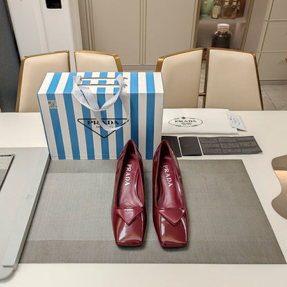 PRADA TRIANGLE LOGO PUMPS IN CURRANT RED GLOSSY CALFSKIN